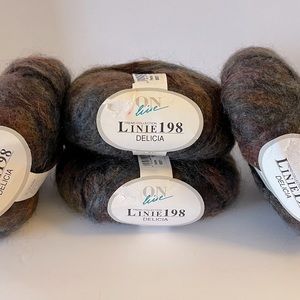 Four skeins of Linie 198 Delicia new beautiful variegated 65% mohair yarn.